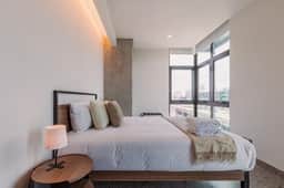 Modern 2-BR Retreat w/ Gym & Pool | VIATO HOMES - Image 5
