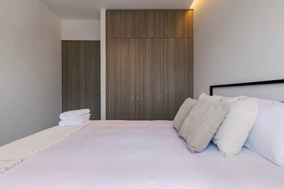 Modern 2-BR Retreat w/ Gym & Pool | VIATO HOMES - Image 4